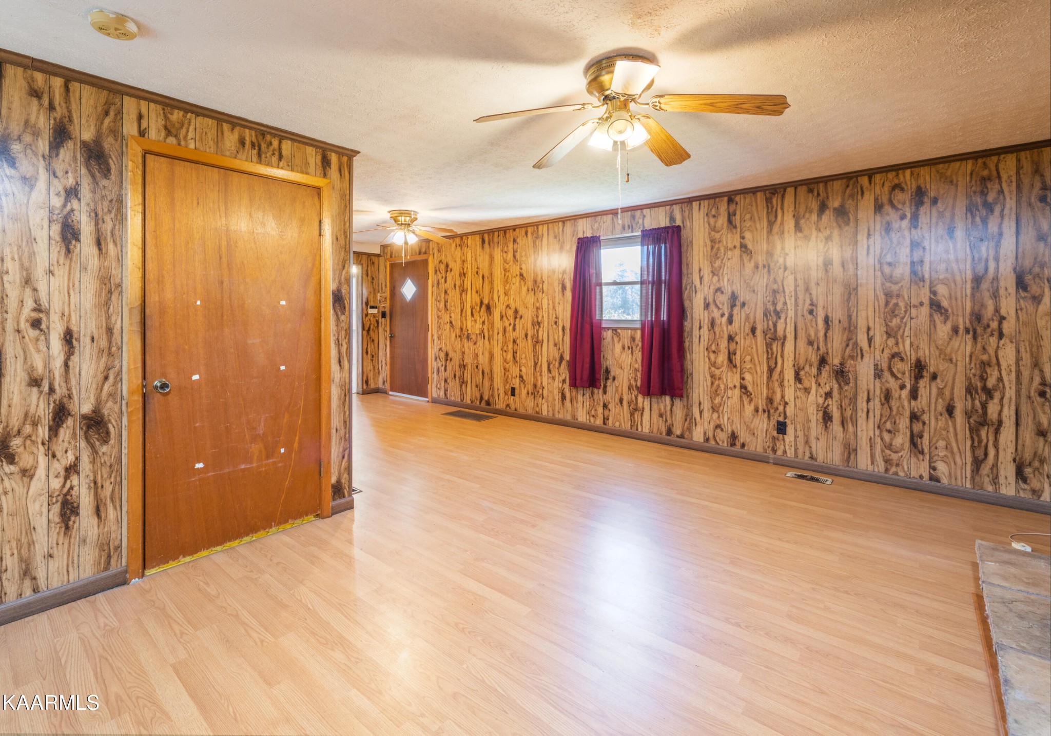 372 Raccoon Valley Road, Unit 1 Maynardville, TN 37807 - Photo 2 of 42 wooden floor in an empty room with a window