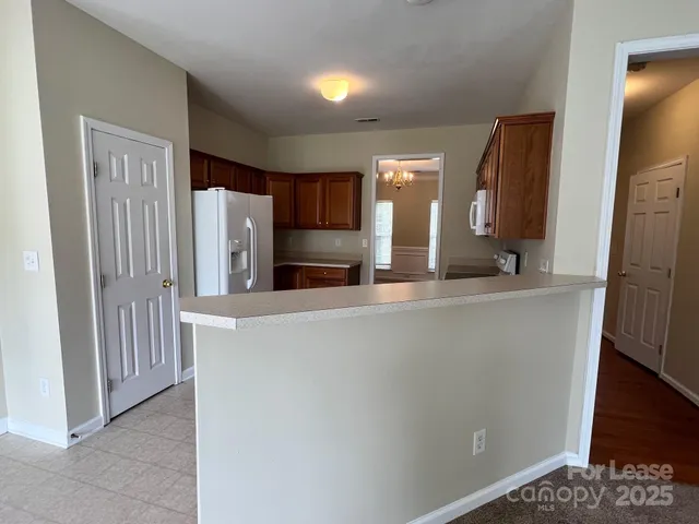 a view of a kitchen from the hallway