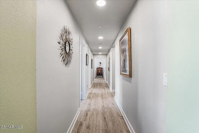 a kitchen with a stove and a refrigerator