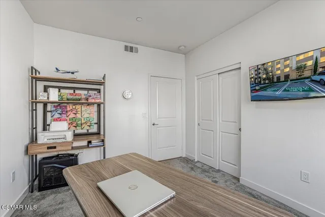 a spacious bathroom with a double vanity sink and a mirror