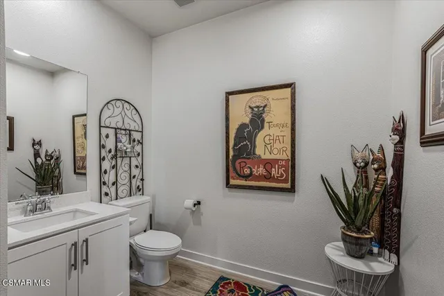 a living room with furniture flat screen tv and a large window