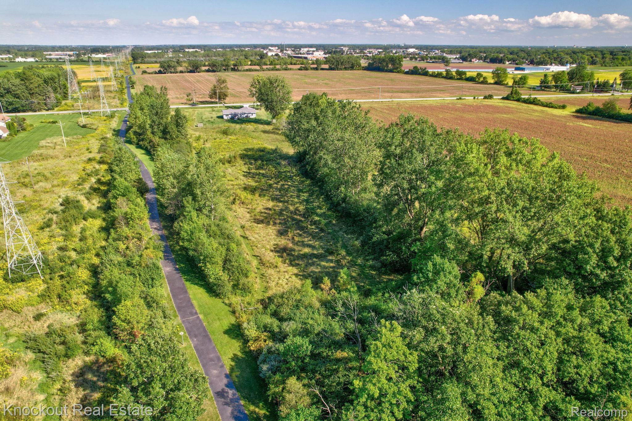 5727 Mackinaw Road Saginaw, MI 48604 - Photo 54 of 60 Expansive land parcel with surrounding agricultural fields and mature tree lines
