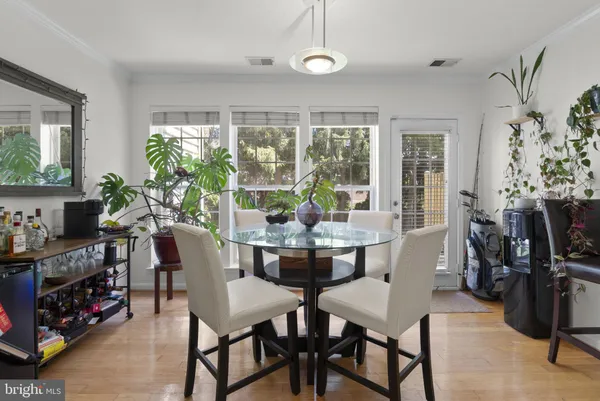 a view of a dining room with furniture window and outside view