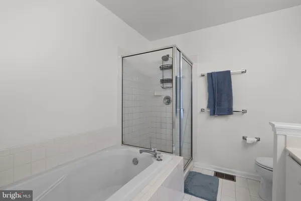 a bathroom with a bathtub and shower