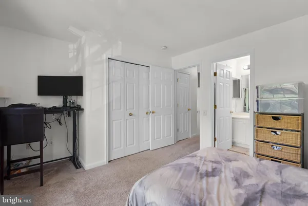 a bed room with a bed and a television
