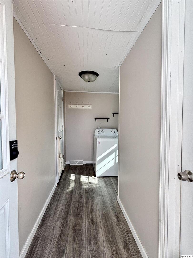41 Main Street Carthage, IL 62321 - Photo 6 of 27 a view of a hallway with wooden floor