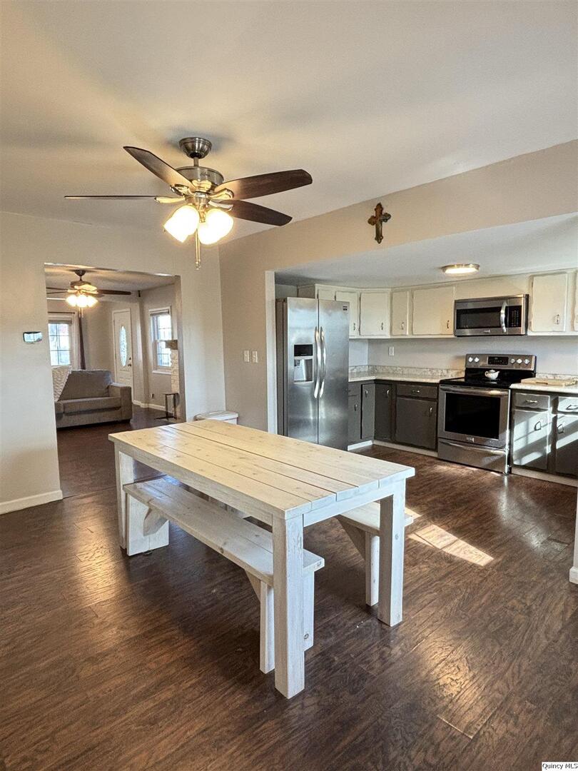 41 Main Street Carthage, IL 62321 - Photo 7 of 27 a living room with stainless steel appliances kitchen island granite countertop furniture and a fireplace