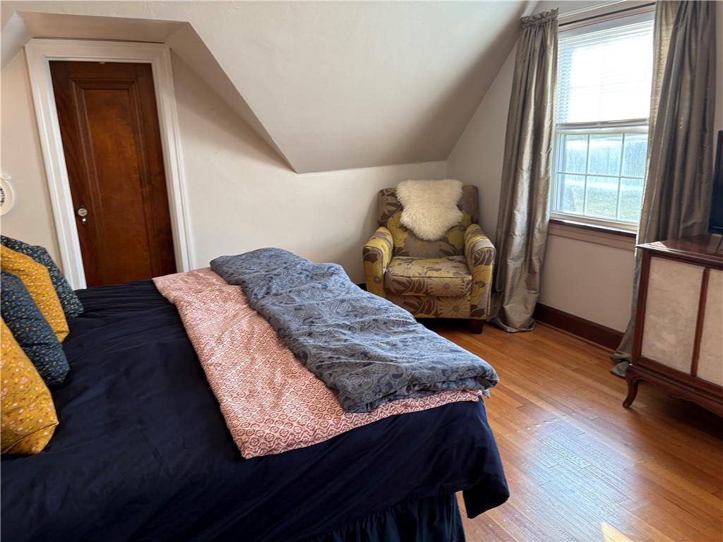 800 Tuscarawas Road Beaver, PA 15009 - Photo 16 of 26 a bedroom with a bed and wooden floor