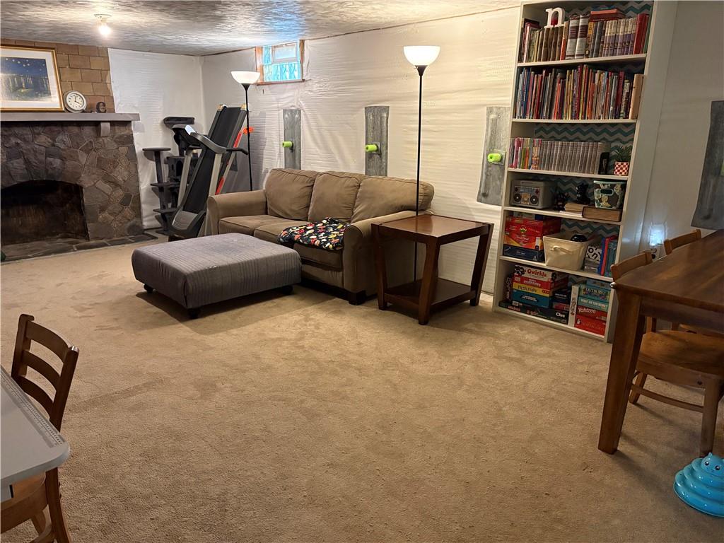 800 Tuscarawas Road Beaver, PA 15009 - Photo 19 of 26 a living room with furniture a bookshelf and a fireplace