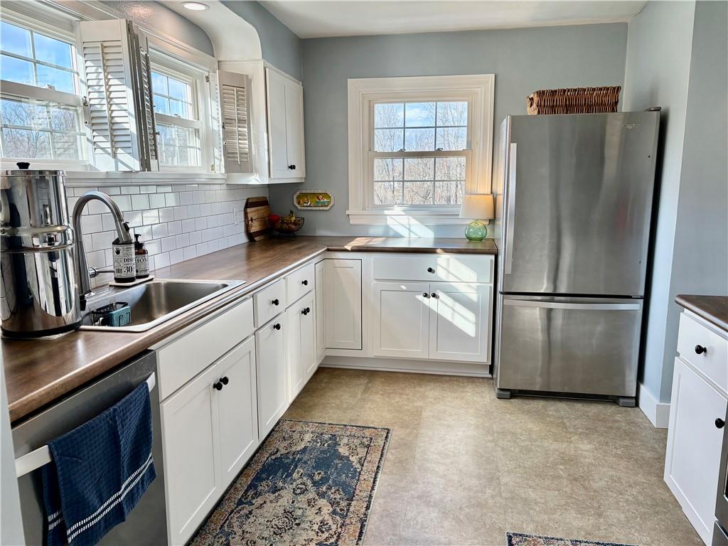 800 Tuscarawas Road Beaver, PA 15009 - Photo 3 of 26 a kitchen with a refrigerator sink and cabinets