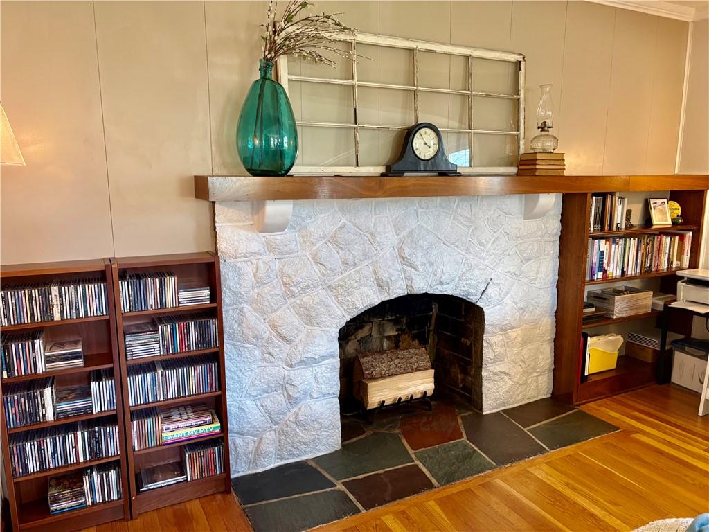 800 Tuscarawas Road Beaver, PA 15009 - Photo 6 of 26 a living room with bookshelf and a fireplace