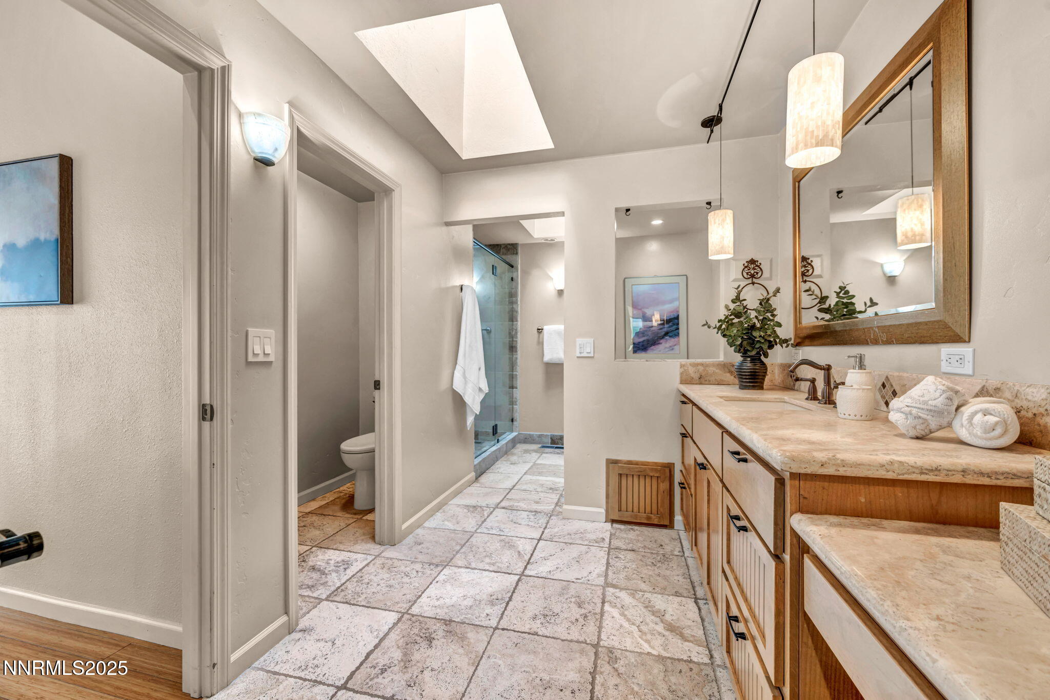 3904 Henry Court Reno, NV 89509 - Photo 20 of 32 a spacious bathroom with a granite countertop sink a mirror and a shower