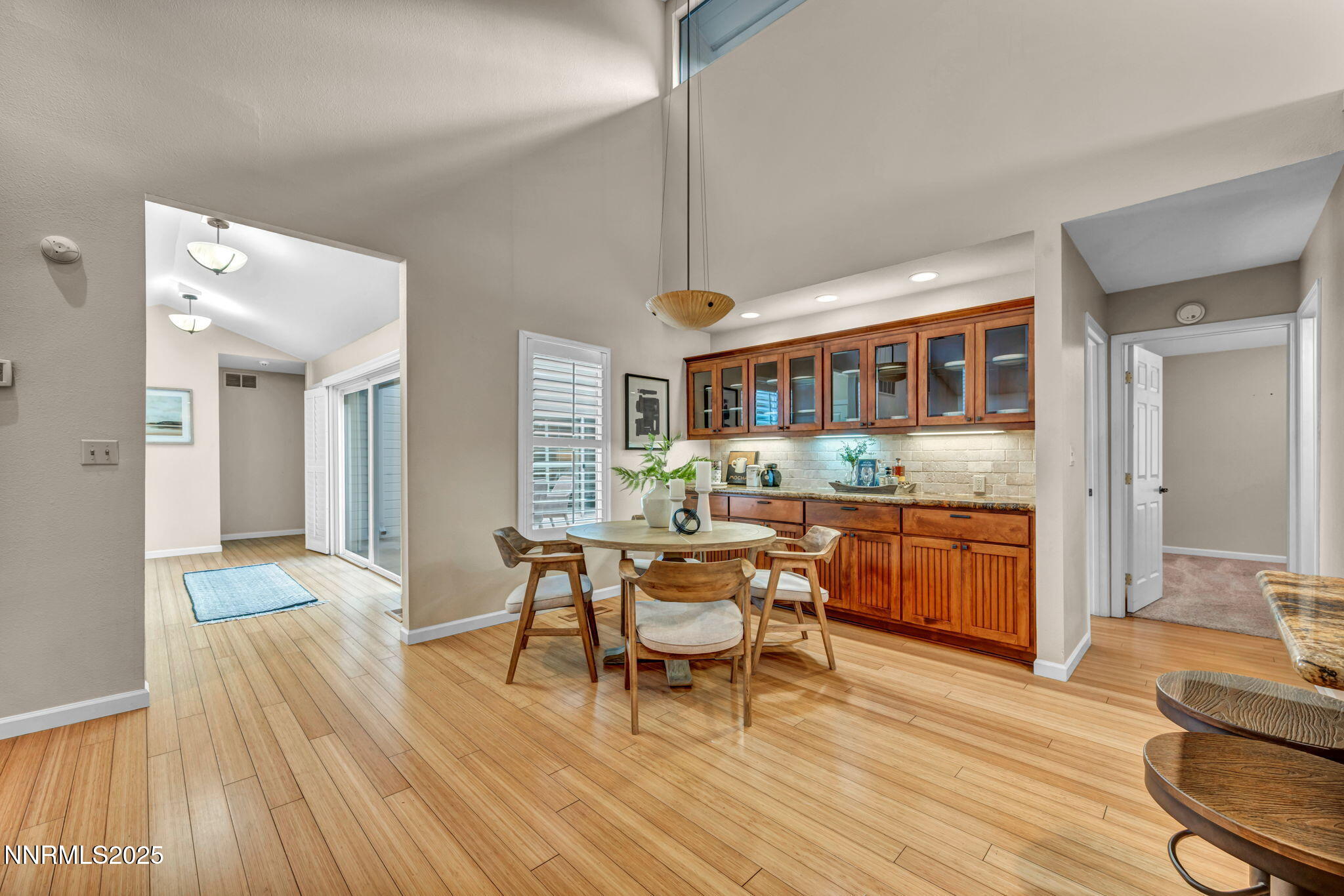 3904 Henry Court Reno, NV 89509 - Photo 22 of 32 a living room with furniture a wooden floor and a kitchen view