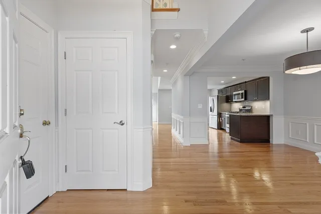 a view of a kitchen refrigerator and microwave