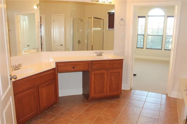 a bathroom with a bathtub and a shower