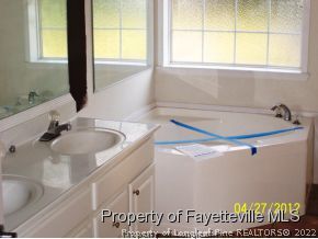 224 Wright Road Vass, NC 28394 - Photo 7 of 11 a bathroom with a sink and a window