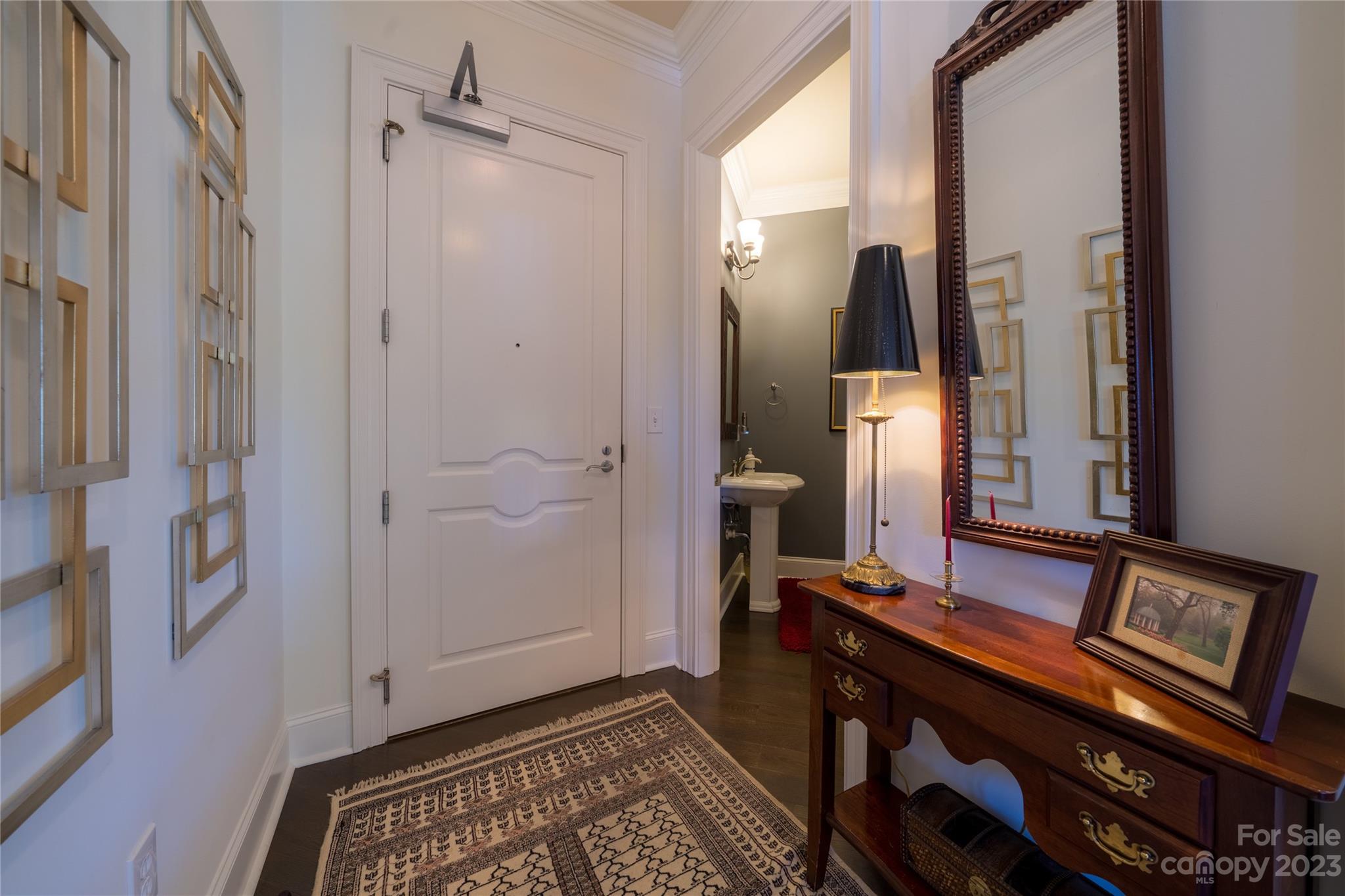 626 Queens Road, Unit 303 Charlotte, NC 28207 - Photo 12 of 41 a view of hallway with furniture and a mirror
