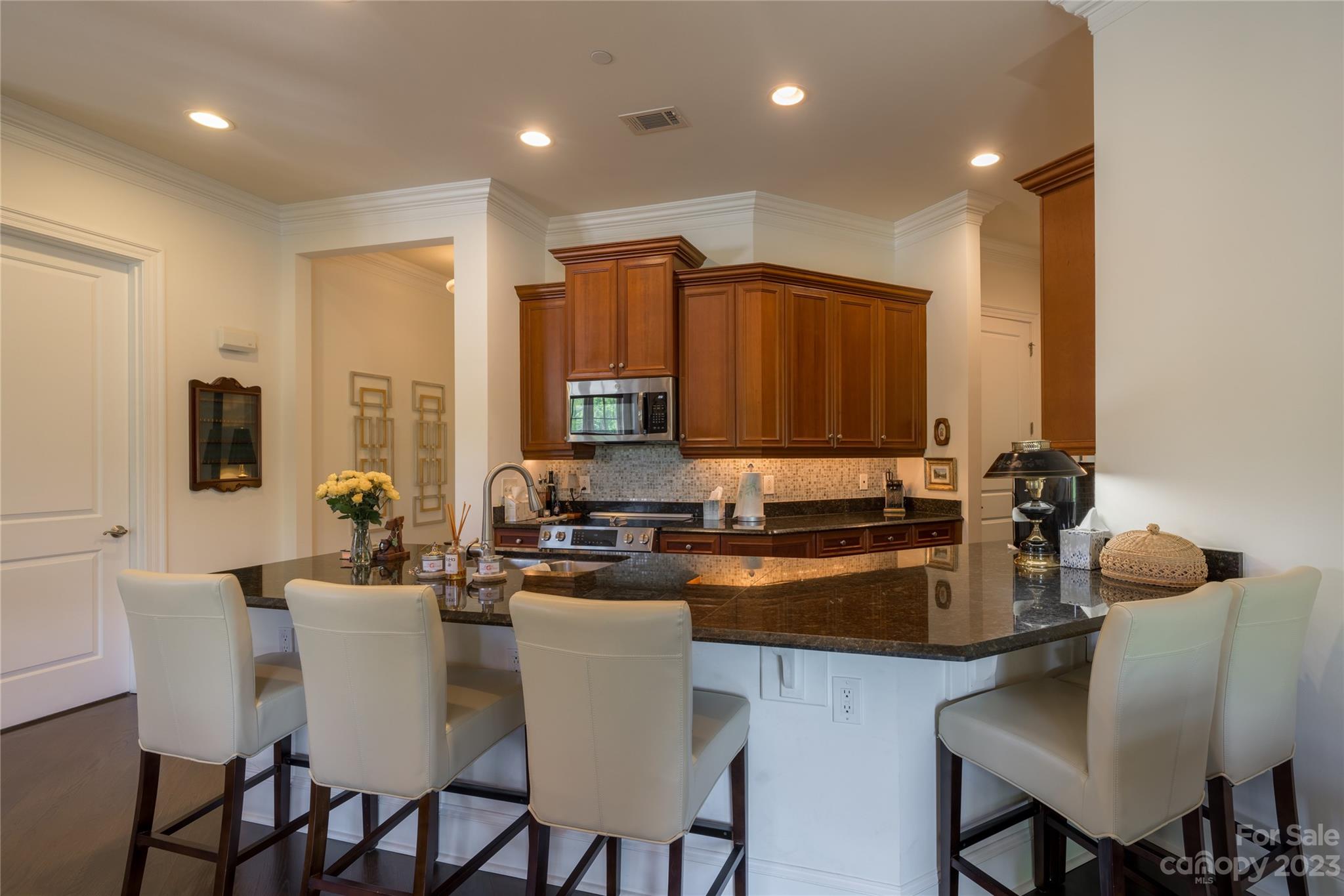 626 Queens Road, Unit 303 Charlotte, NC 28207 - Photo 18 of 41 a kitchen with a sink cabinets and window