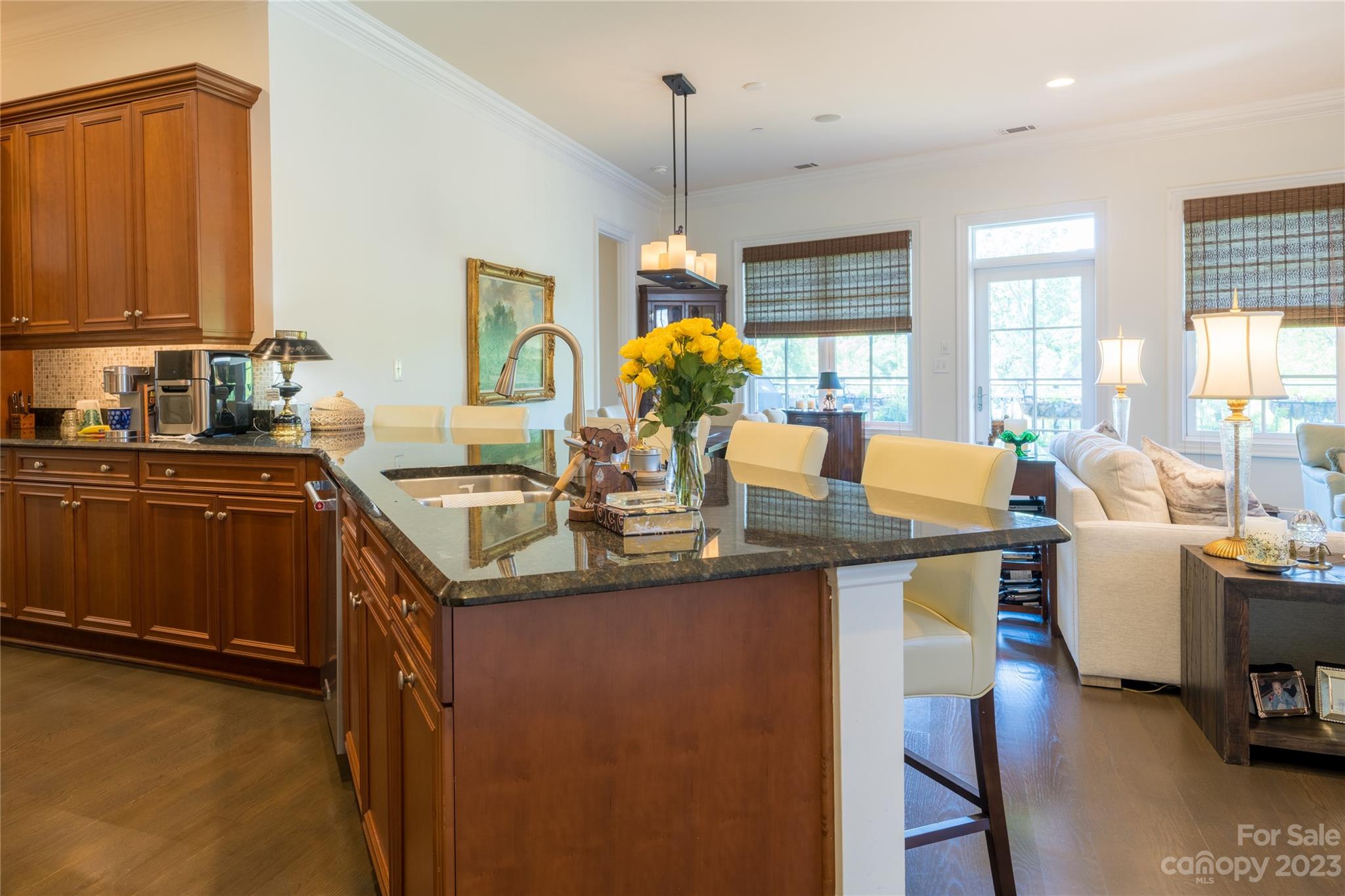 626 Queens Road, Unit 303 Charlotte, NC 28207 - Photo 20 of 41 a kitchen with granite countertop a sink cabinets and window