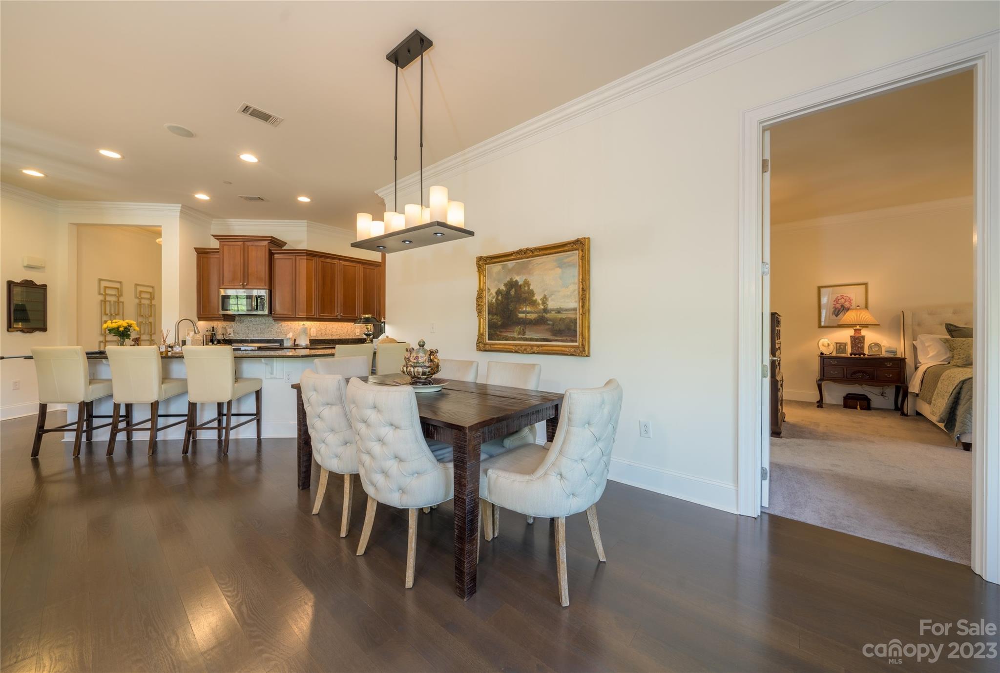 626 Queens Road, Unit 303 Charlotte, NC 28207 - Photo 24 of 41 a view of a dining room with furniture and wooden floor