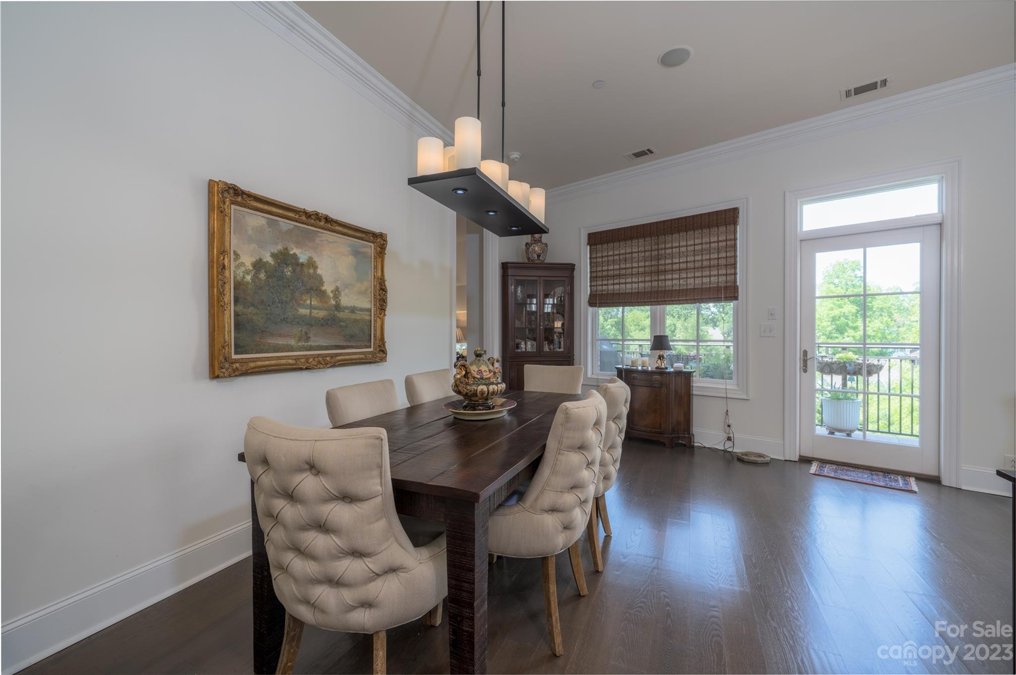 626 Queens Road, Unit 303 Charlotte, NC 28207 - Photo 25 of 41 a view of a dining room with furniture wooden floor and chandelier