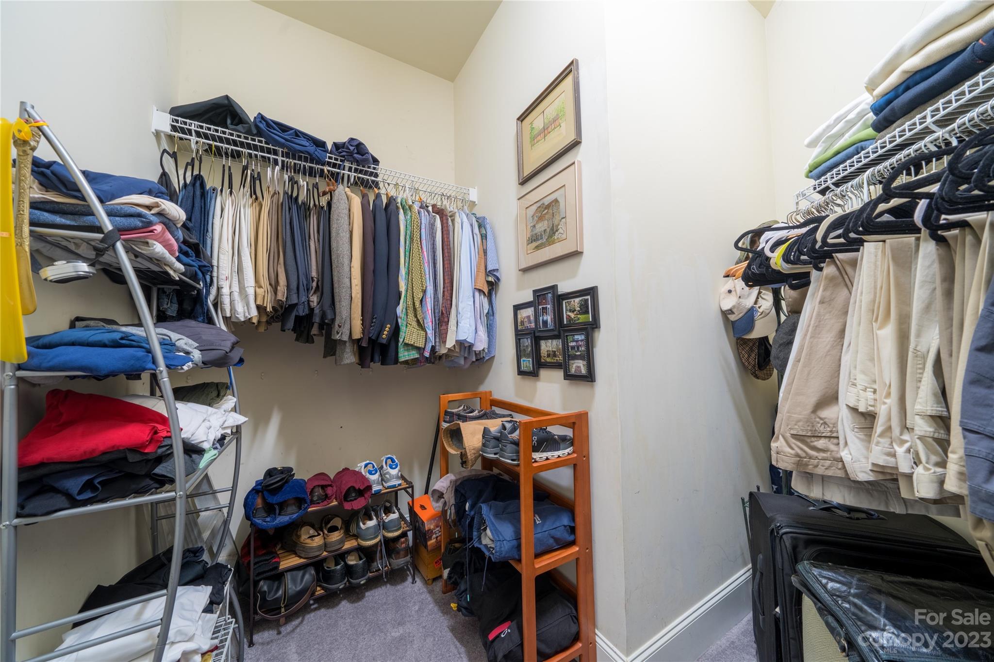 626 Queens Road, Unit 303 Charlotte, NC 28207 - Photo 38 of 41 a view of walk in closet with clothes and shoes