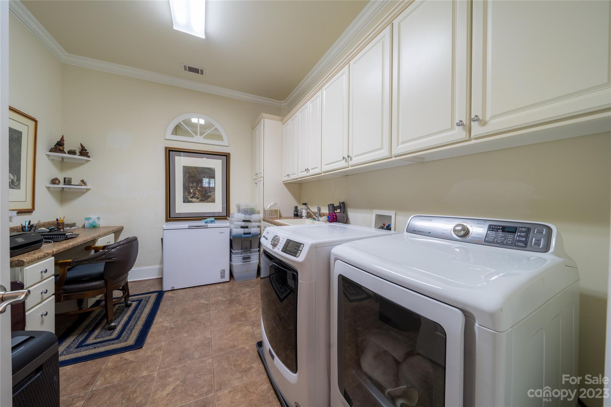 626 Queens Road, Unit 303 Charlotte, NC 28207 - Photo 39 of 41 a utility room with dryer and washer