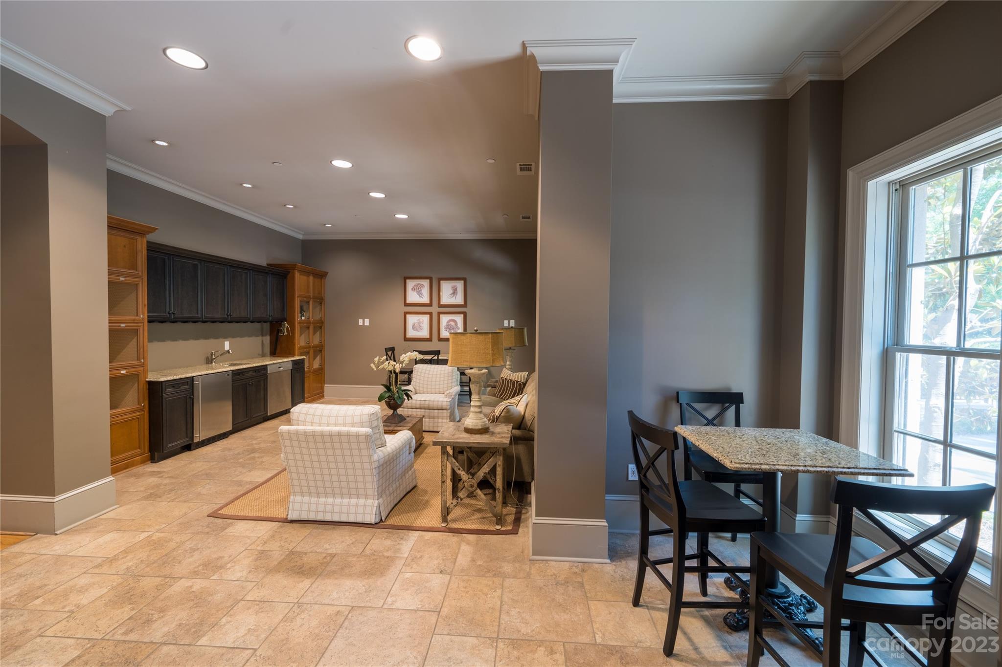 626 Queens Road, Unit 303 Charlotte, NC 28207 - Photo 7 of 41 a view of a dining room with furniture