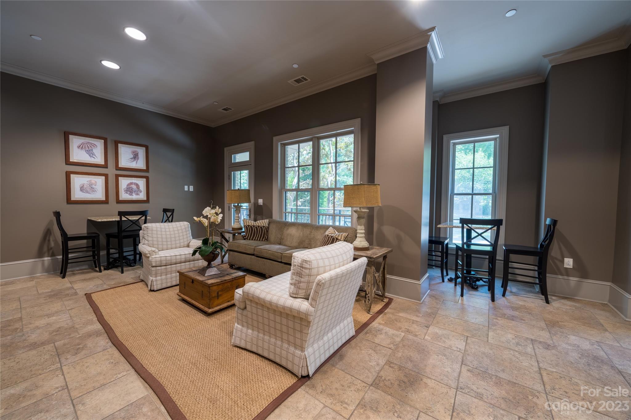 626 Queens Road, Unit 303 Charlotte, NC 28207 - Photo 8 of 41 a living room with fireplace furniture and two windows