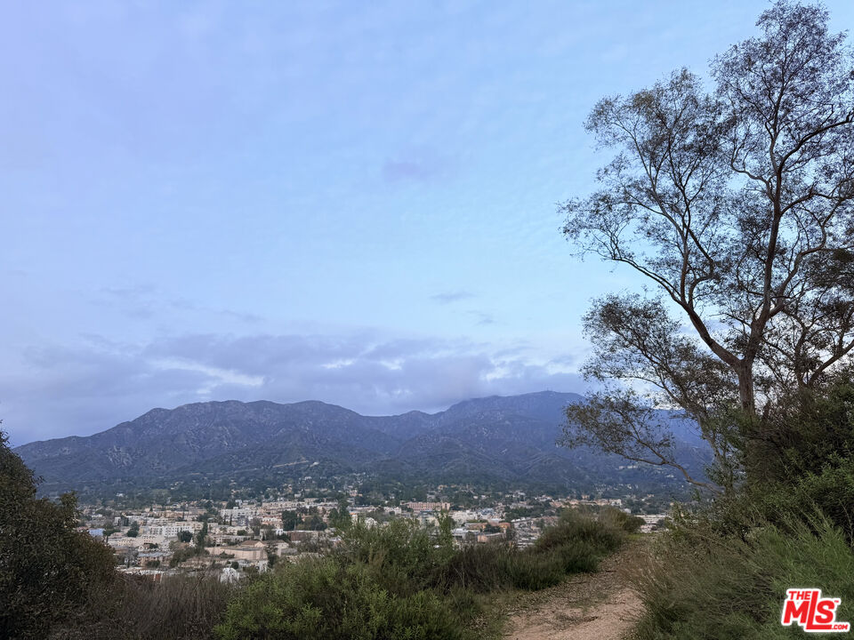 a view of a town with mountains in the background