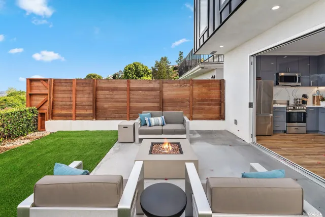 a view of a garden with a building in the background