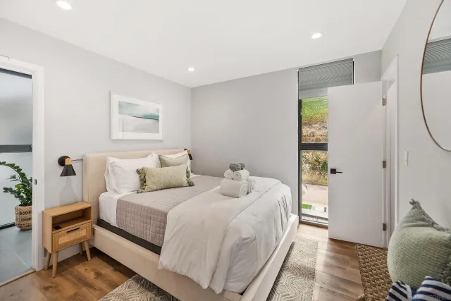 a view of a patio with couches and table and chairs and potted plants
