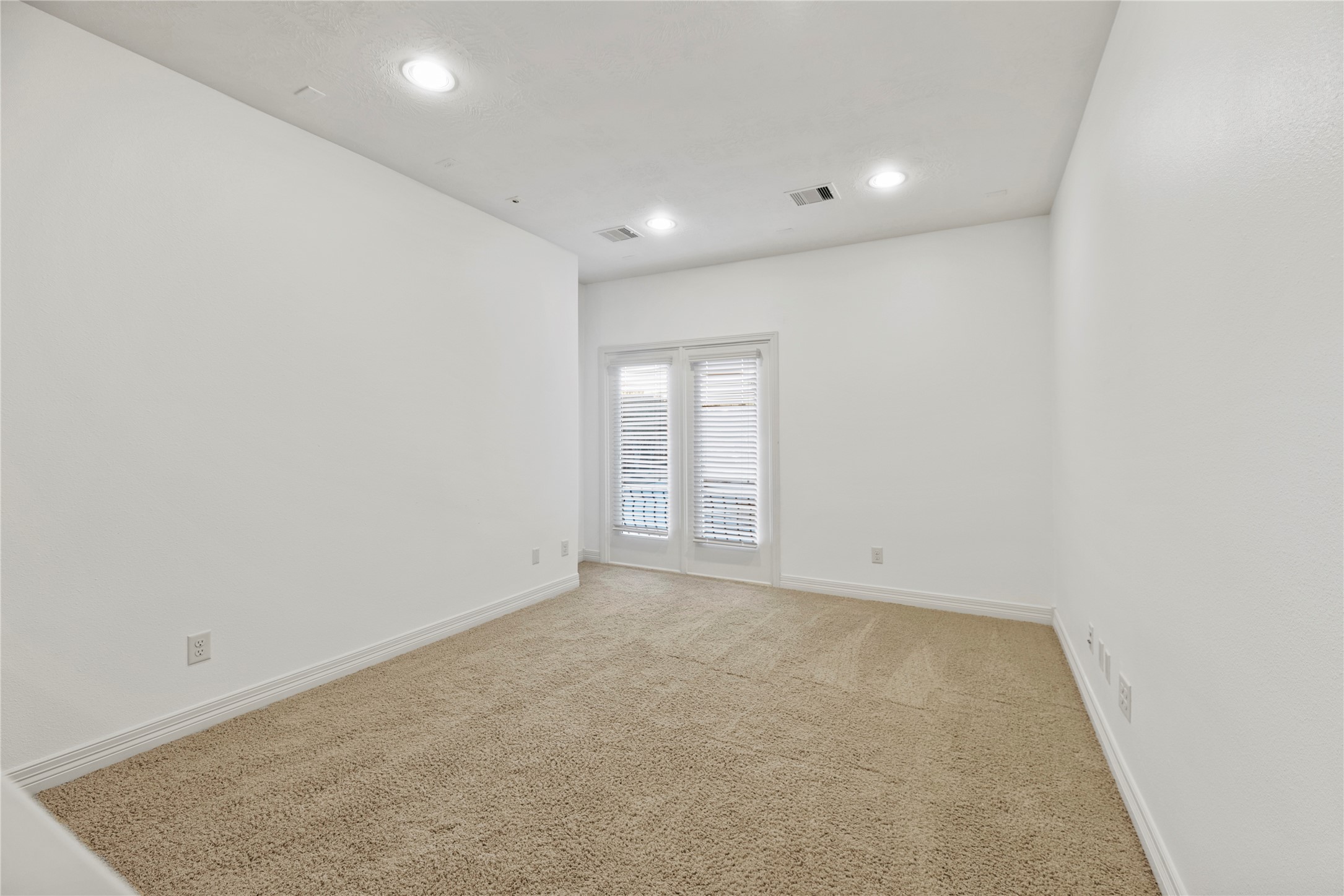 5827 Amherst Farms Lane Fulshear, TX 77441 - Photo 24 of 48 Located just off the upstairs game room, this versatile space offers endless possibilities. Whether you envision an expanded entertainment area, a dedicated study zone, a playroom, or a media/video game retreat, this flexible space easily adapts. French doors open to a charming Juliet balcony overlooking the front yard.