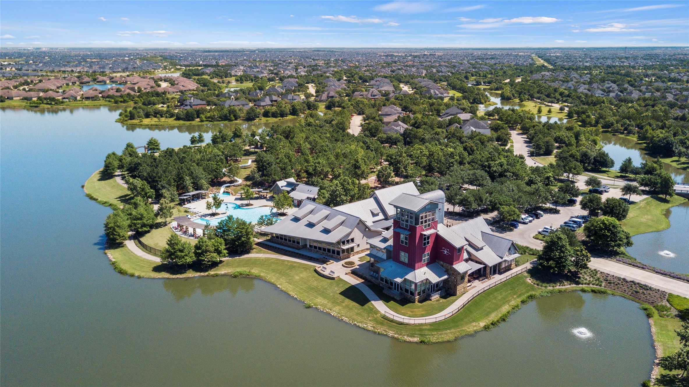 5827 Amherst Farms Lane Fulshear, TX 77441 - Photo 42 of 48 Sweeping views of the serene lake highlight the natural beauty woven throughout Cross Creek Ranch. Paved walking trails wind along the water’s edge, with benches and shaded green space providing the perfect setting for jogging, biking, or evening strolls.