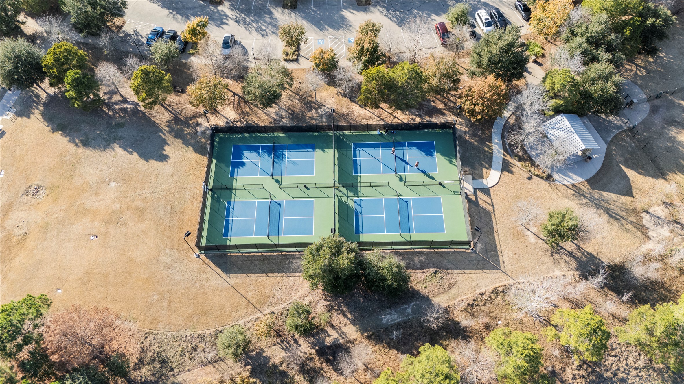 5827 Amherst Farms Lane Fulshear, TX 77441 - Photo 45 of 48 Multiple lighted sport courts provide residents with opportunities for recreation and friendly competition. Located within a landscaped park setting, the courts are easily accessible and well-maintained for year-round play.