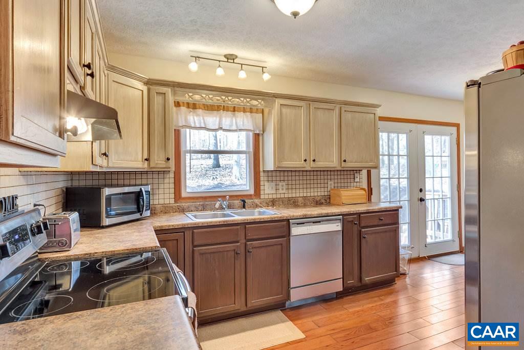 30 East Point Road Palmyra, VA 22963 - Photo 13 of 38 a kitchen with stainless steel appliances granite countertop a stove and a sink