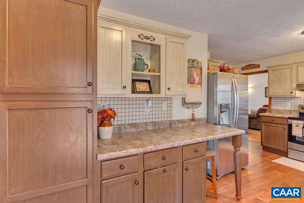 30 East Point Road Palmyra, VA 22963 - Photo 15 of 38 a kitchen with stainless steel appliances granite countertop a sink and cabinets