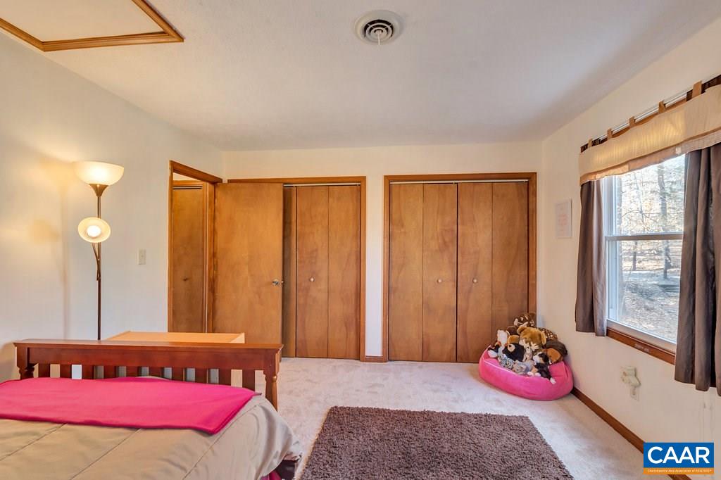 30 East Point Road Palmyra, VA 22963 - Photo 26 of 38 a bedroom with a bed and closet