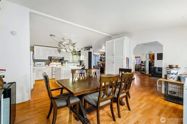 a view of a dining room with furniture and wooden floor