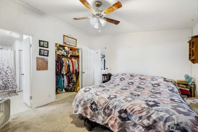 a bedroom with a bed and a walk in closet