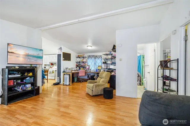 a view of a livingroom with furniture and a flat screen tv