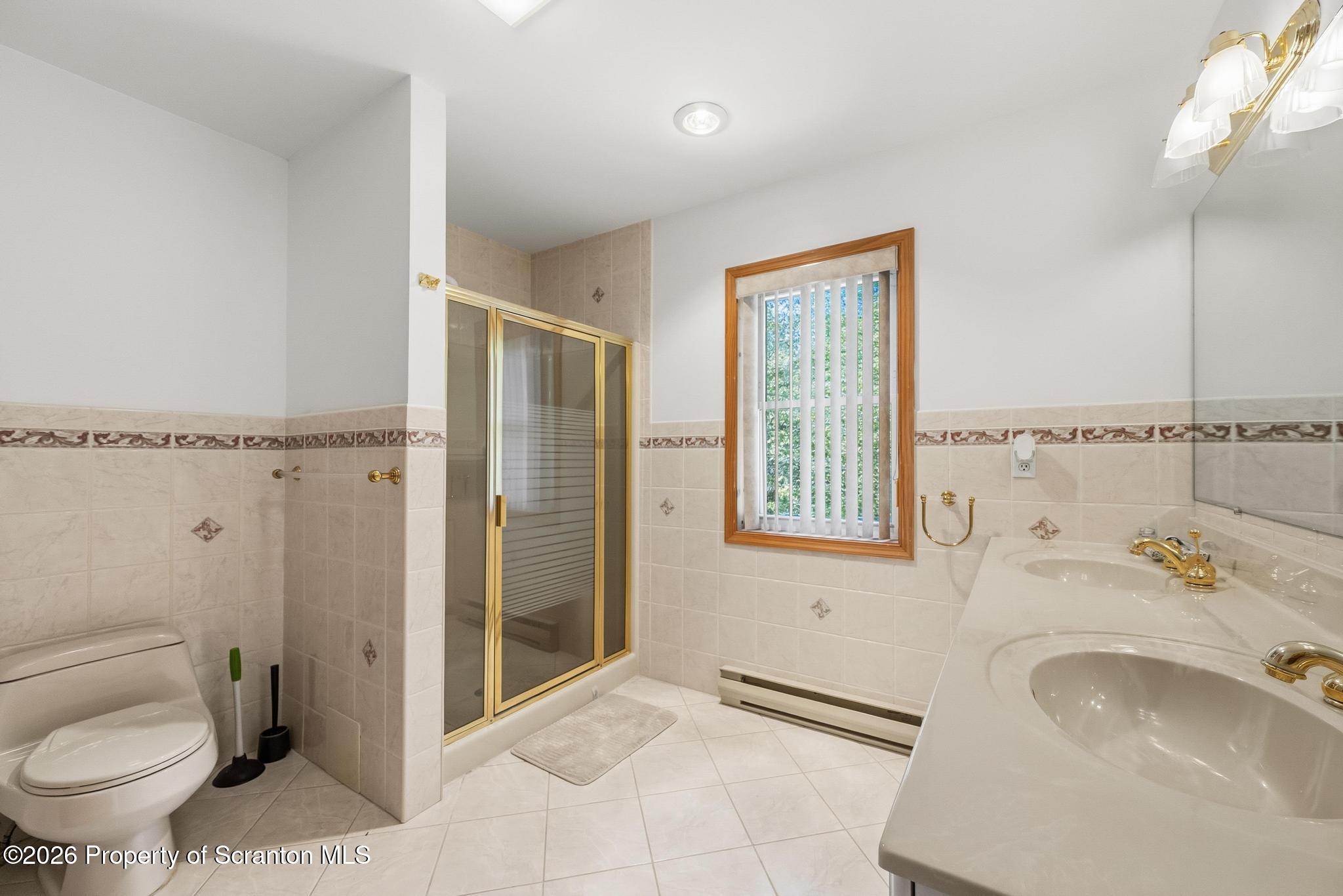 58 Bender Road Gouldsboro, PA 18424 - Photo 30 of 55 a bathroom with a sink toilet and shower