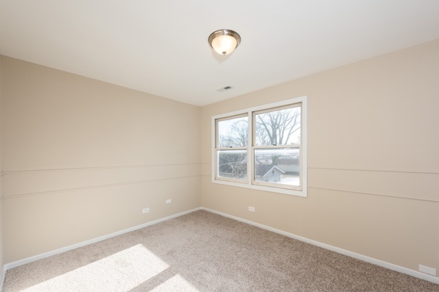 1111 Webster Lane Des Plaines, IL 60016 - Photo 11 of 25 a view of an empty room with a window