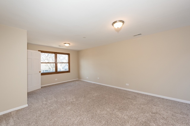 1111 Webster Lane Des Plaines, IL 60016 - Photo 13 of 25 a view of an empty room with a window