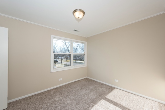 1111 Webster Lane Des Plaines, IL 60016 - Photo 15 of 25 an empty room with a window