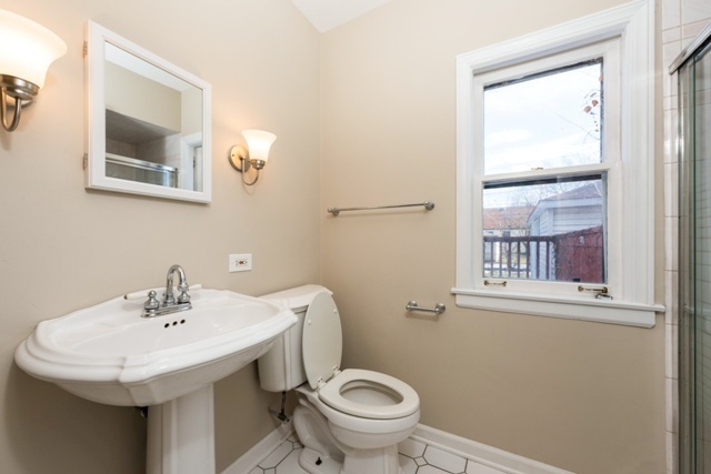 1111 Webster Lane Des Plaines, IL 60016 - Photo 18 of 25 a bathroom with a sink and a toilet