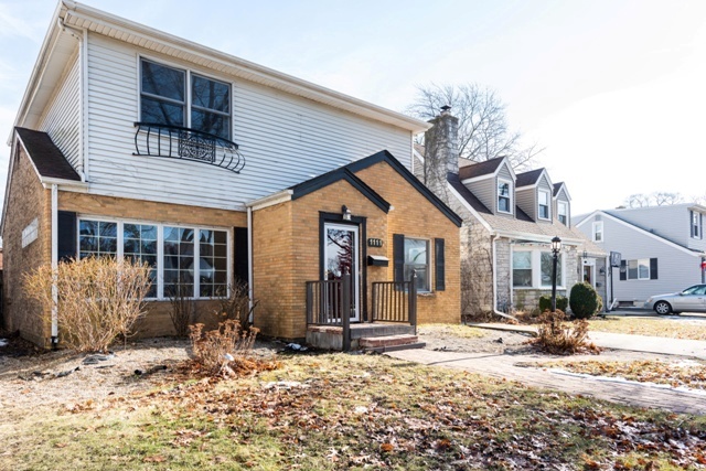 1111 Webster Lane Des Plaines, IL 60016 - Photo 25 of 25 a front view of a house with a yard