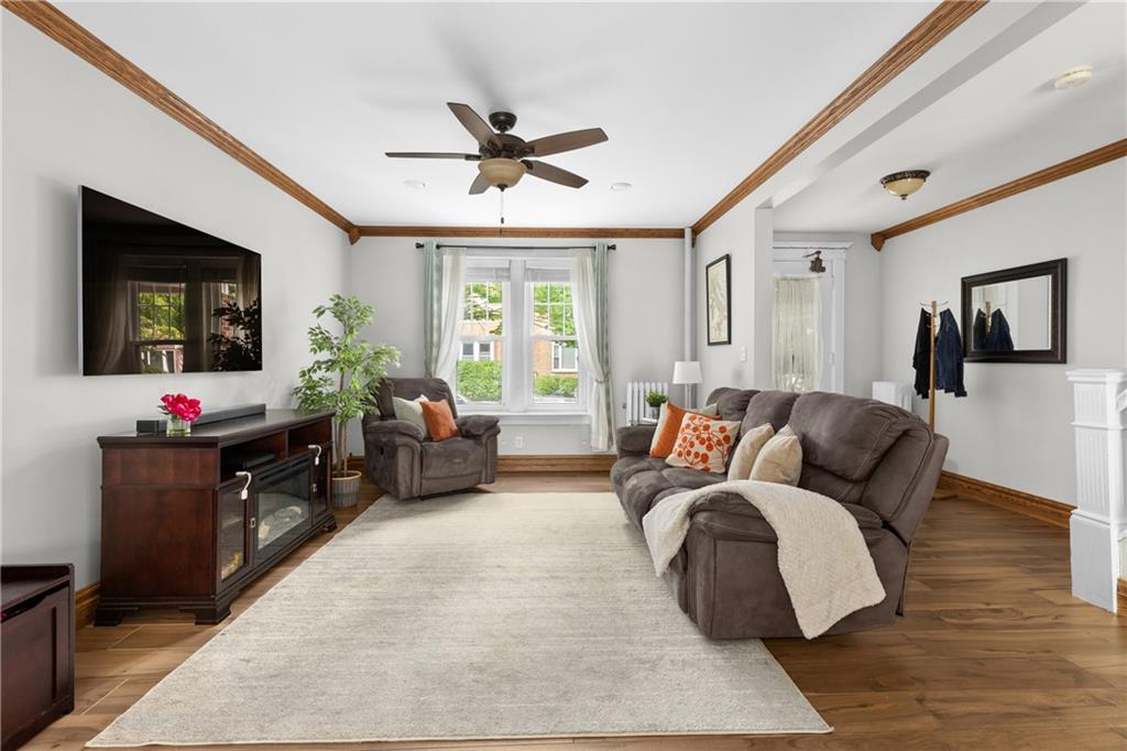 552 77th Street Brooklyn, NY 11209 - Photo 5 of 14 a living room with furniture and a flat screen tv