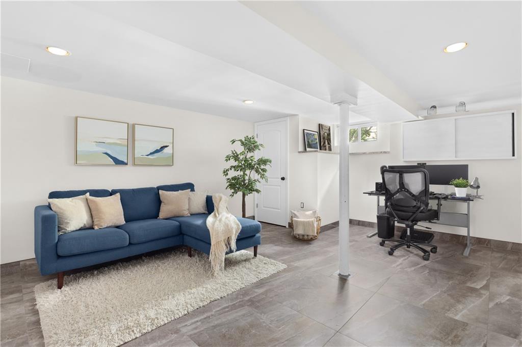 552 77th Street Brooklyn, NY 11209 - Photo 6 of 14 a living room with furniture a rug and a potted plant