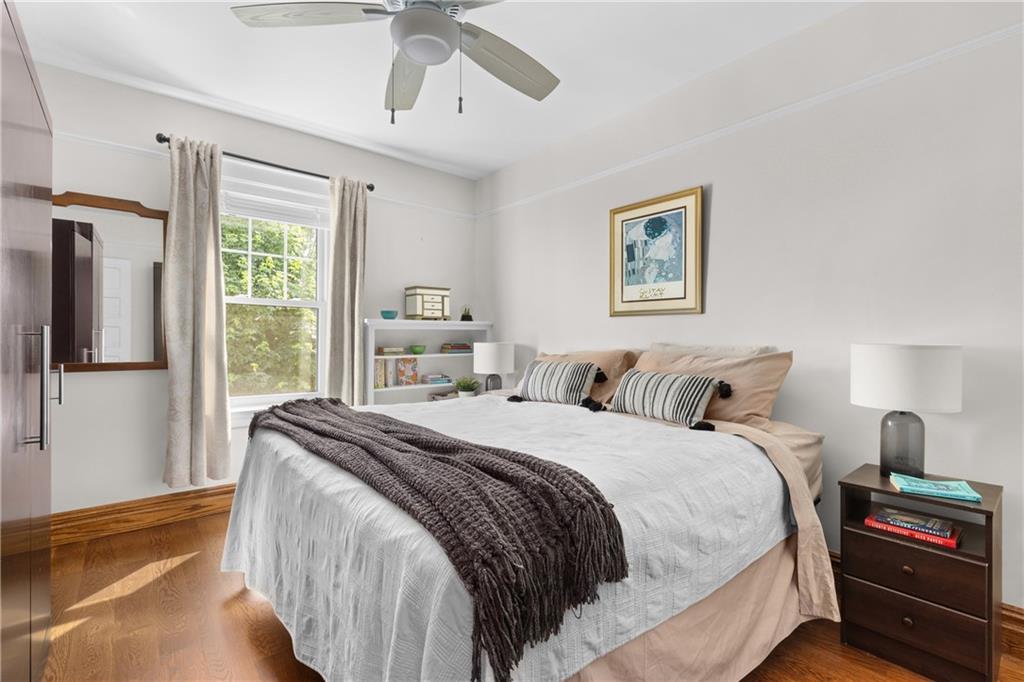552 77th Street Brooklyn, NY 11209 - Photo 7 of 14 a bedroom with a bed and a window